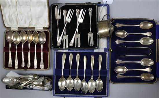 Four cased sets of silver flatware, a silver mustard and a collection of loose spoons etc.